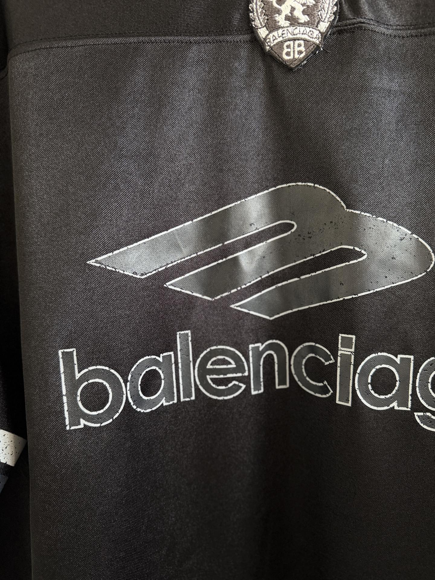 Black Balenciaga polo shirt with large 'balenciaga' logo across the chest