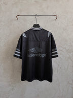 Black short-sleeve polo shirt with striped cuffs and Balenciaga logo on back