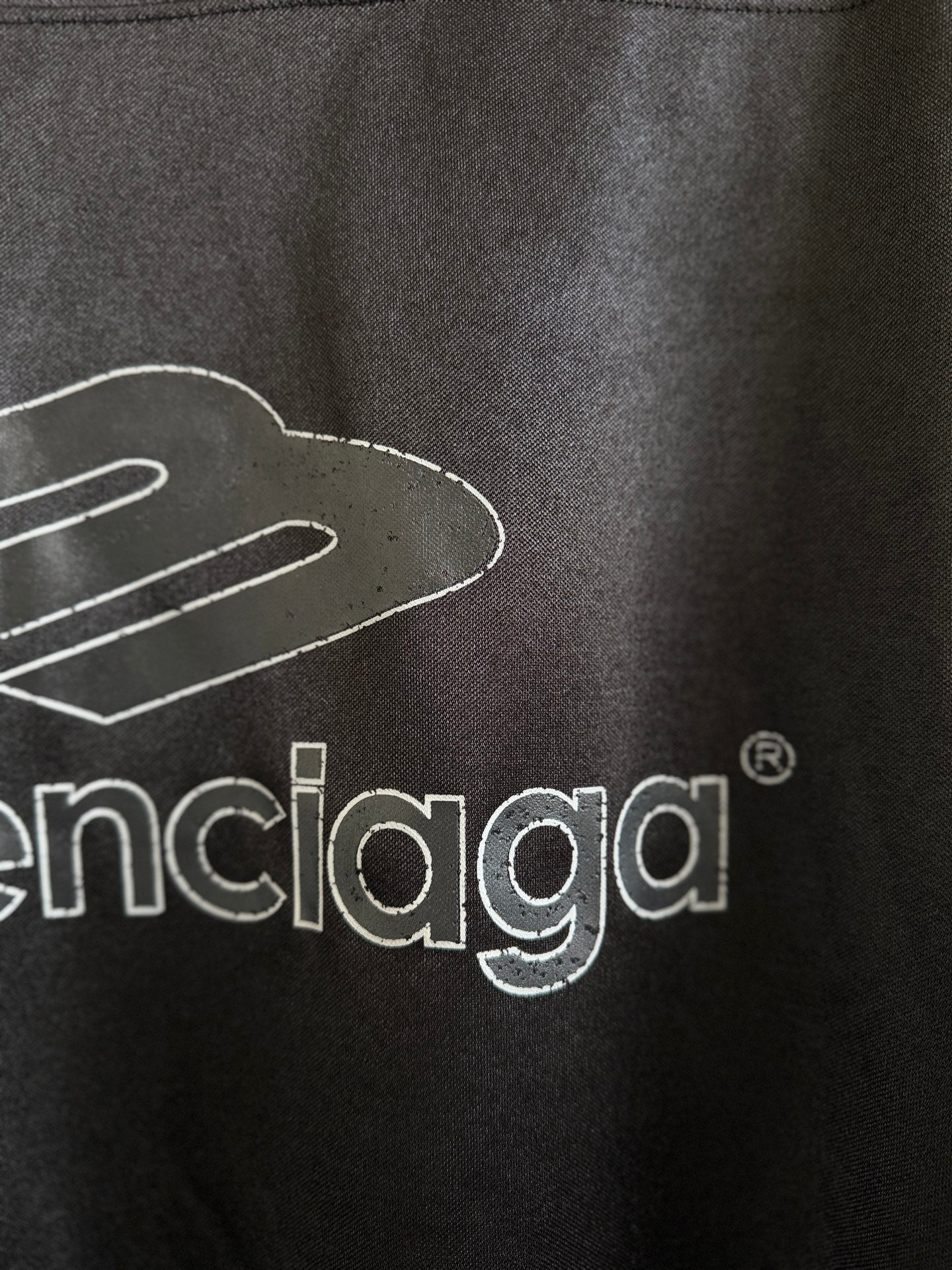 Balenciaga black polo back close-up of balenciaga logo print