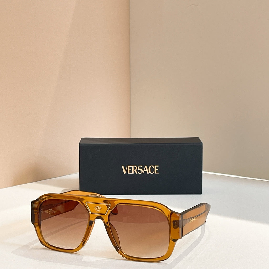 Versace sunglasses with amber frames and orange-brown lenses
