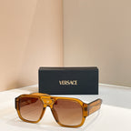 Versace sunglasses with amber frames and orange-brown lenses