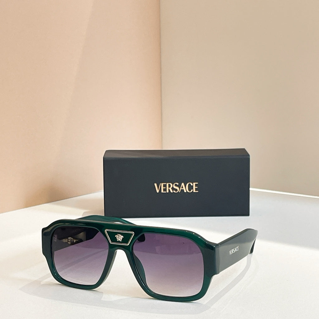 Versace sunglasses with green frames and purple-tinted lenses