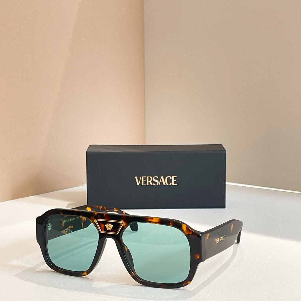 Versace sunglasses with tortoiseshell frames and green-tinted lenses