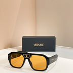 Versace sunglasses with black frames and amber-orange lenses