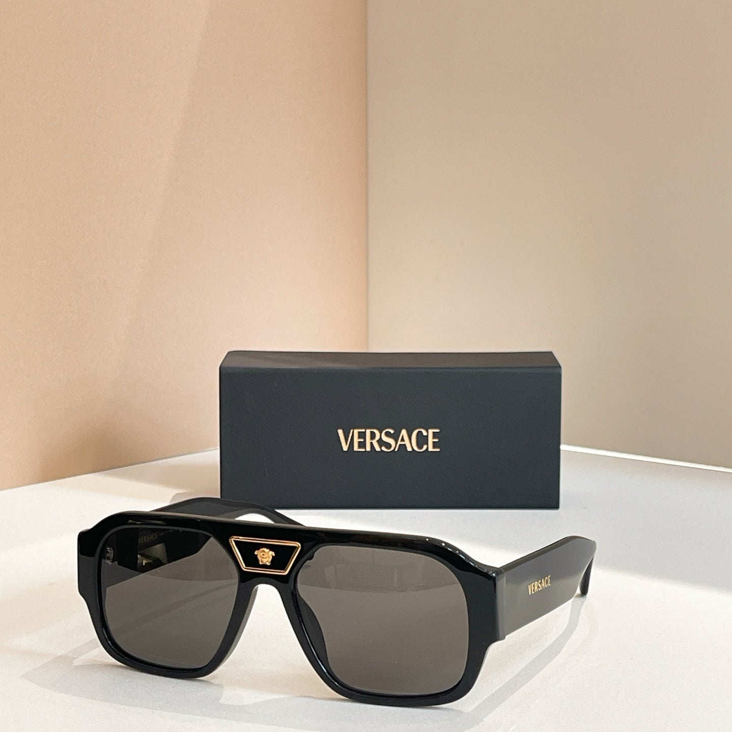 Versace sunglasses with black frames and dark lenses