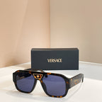 Versace sunglasses with tortoiseshell frames and blue-tinted lenses