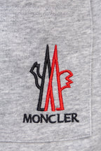 Moncler gray sweatpants with front pocket and large red Moncler logo