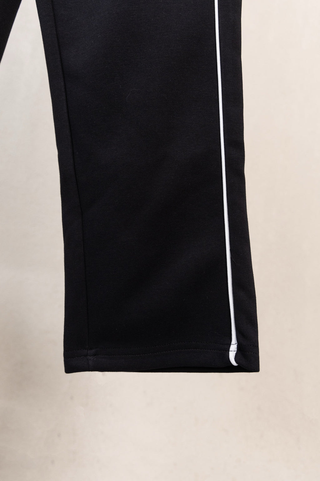Black pants with white side stripe, straight leg