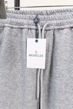 Moncler gray sweatpants waistband with elastic and hanging brand tag