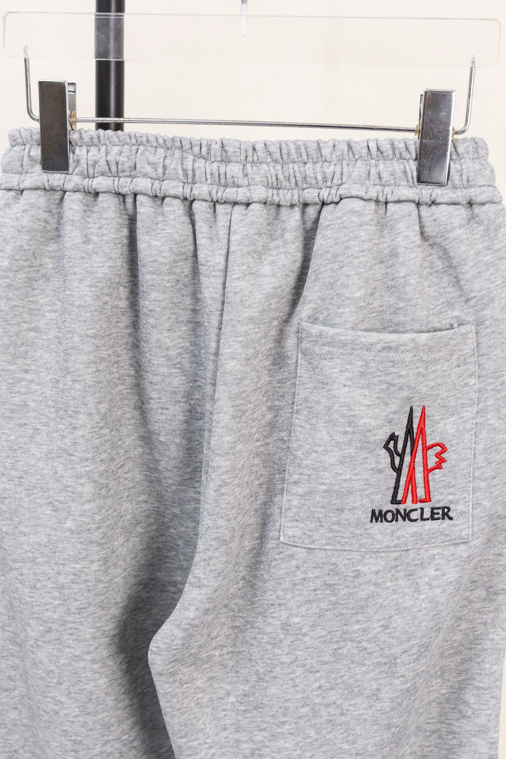Moncler gray sweatpants with side zip pocket and small logo on leg