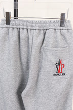 Moncler gray sweatpants with side zip pocket and small logo on leg