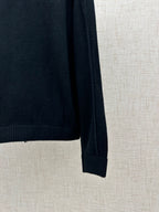 Long-sleeve knit top side with ribbed sleeve cuff and hem, dark navy