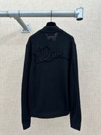 Zip-up knit jacket back view with ribbed high collar and raised logo embroidery