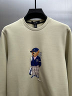 Cream sweatshirt with teddy-bear graphic on the chest