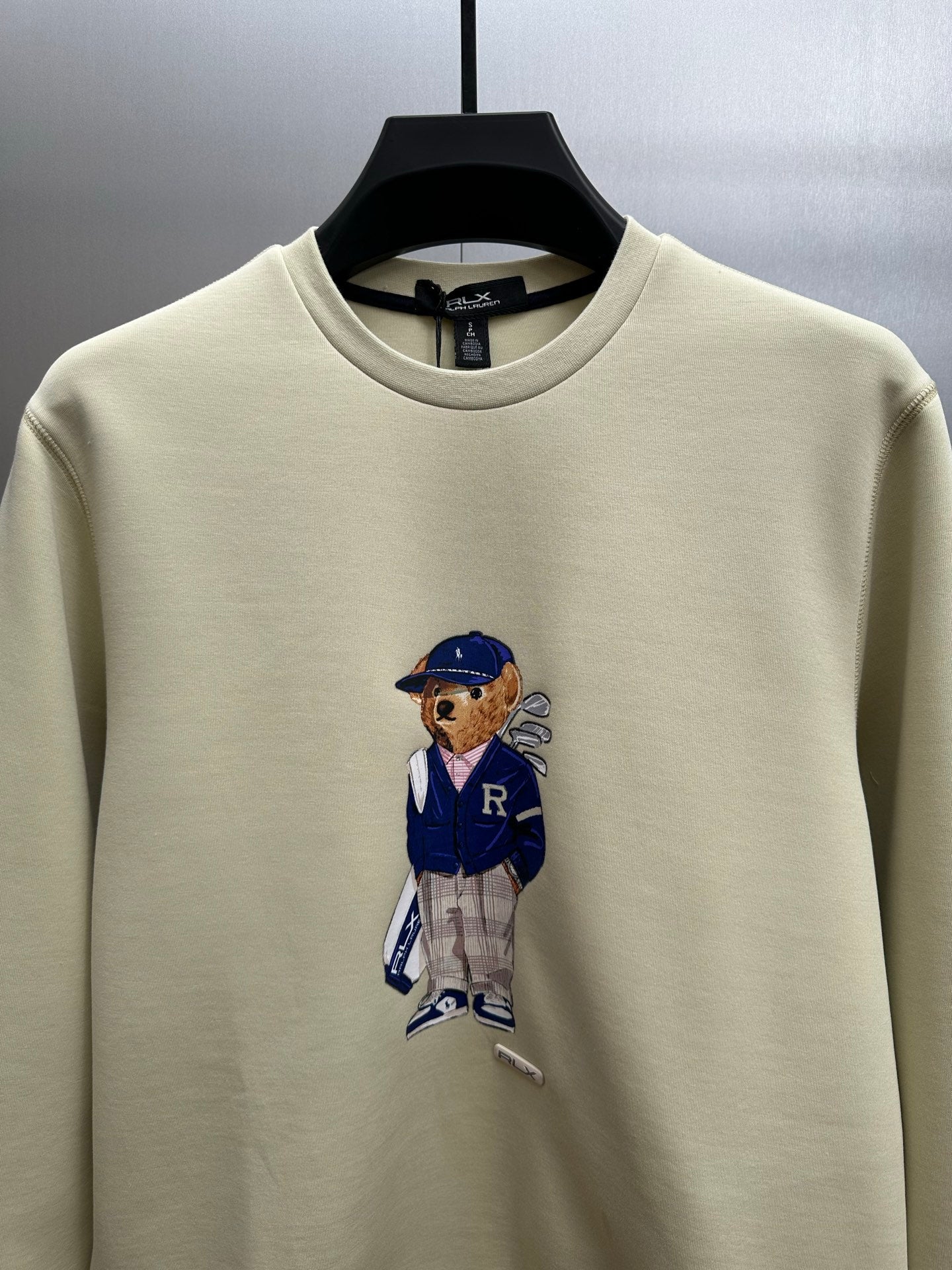 Cream sweatshirt with teddy-bear graphic on the chest