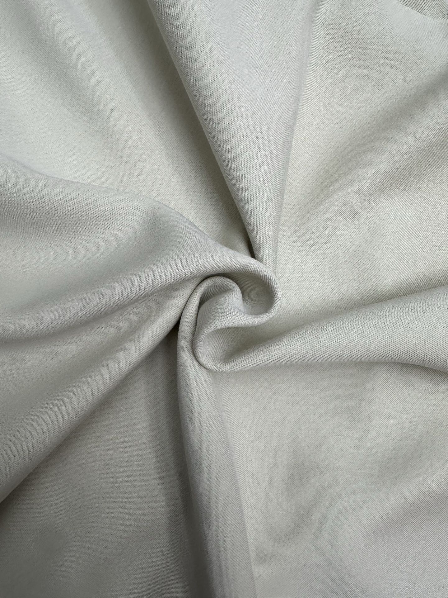 Ralph Lauren clothing, light gray fabric close-up with twisted knot