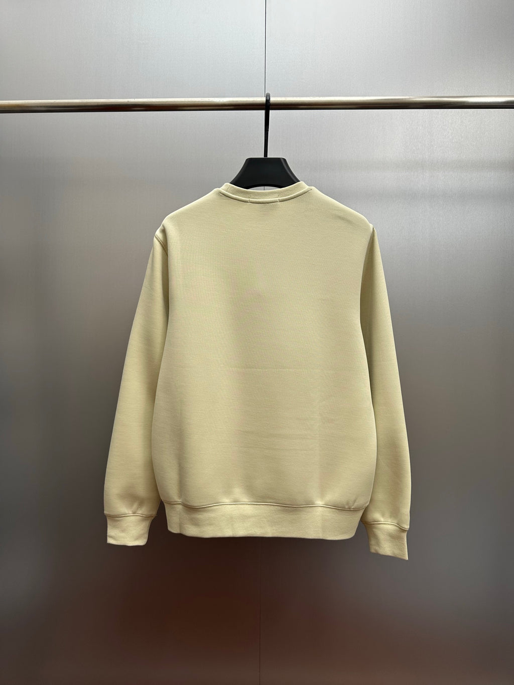 Cream crewneck sweatshirt with ribbed collar and cuffs