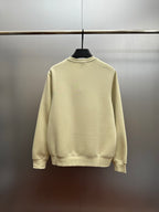 Cream crewneck sweatshirt with ribbed collar and cuffs