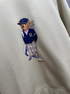 Cream sweatshirt with teddy-bear holding hands graphic