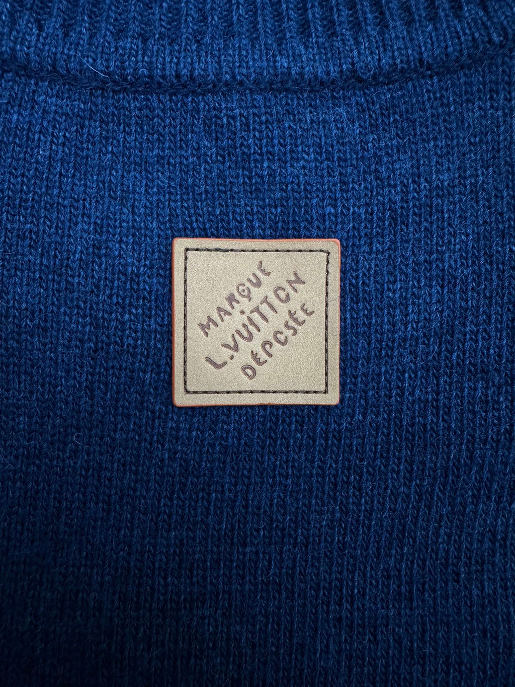 Blue knit long garment with Louis Vuitton logo patch