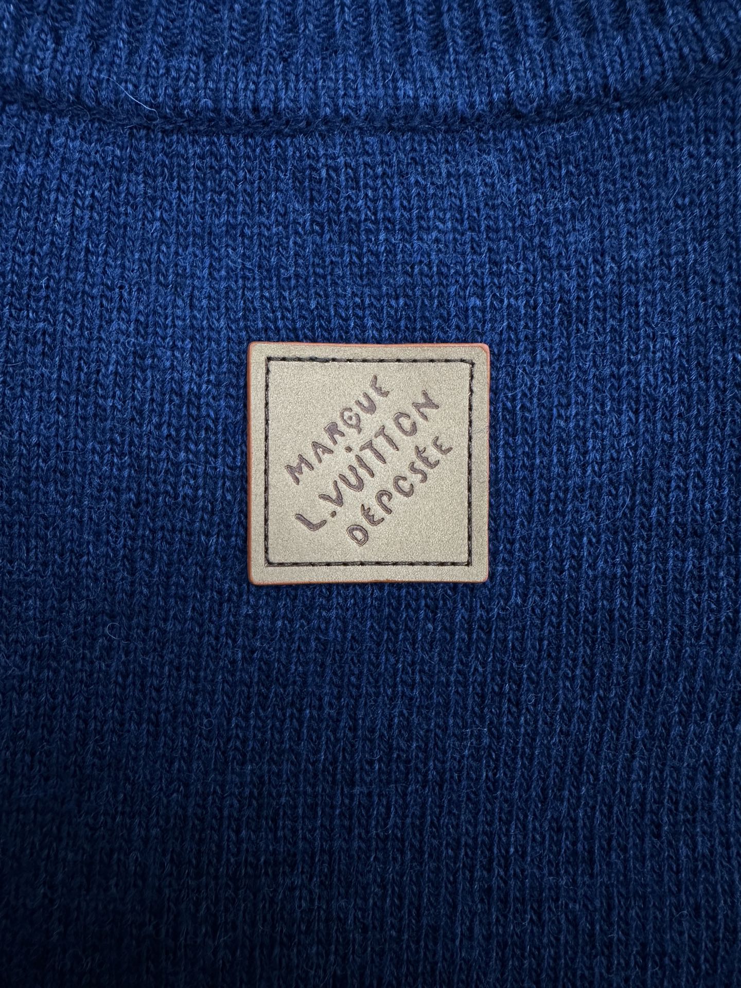 Blue knit long garment with Louis Vuitton logo patch