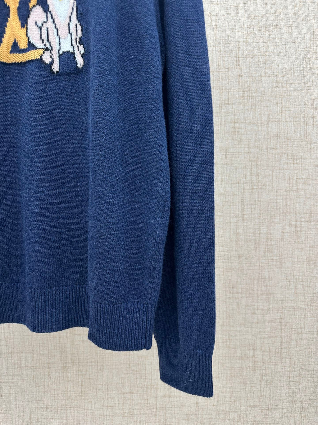 Louis Vuitton knit sweater side view, dark blue with ribbed cuff and hem