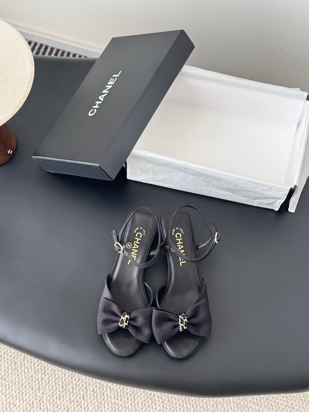 Black bow-detail slingback sandals with gold-tone hardware
