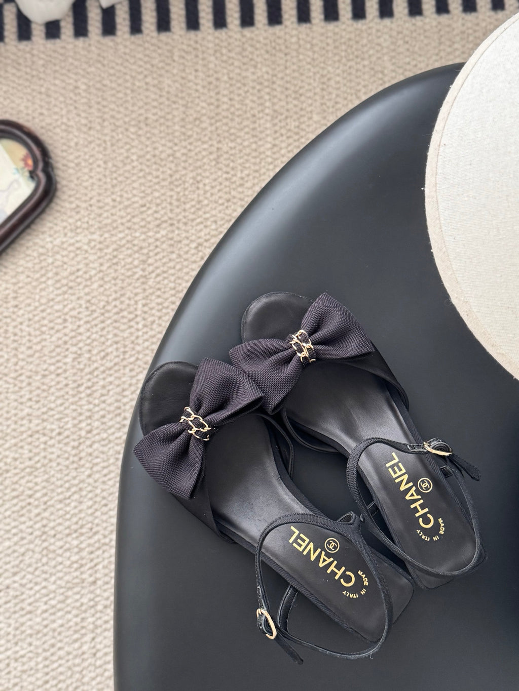 Dark bow slingback sandals with gold-tone charm details