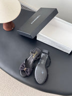 Dark slingback sandals with bow detail and small heel