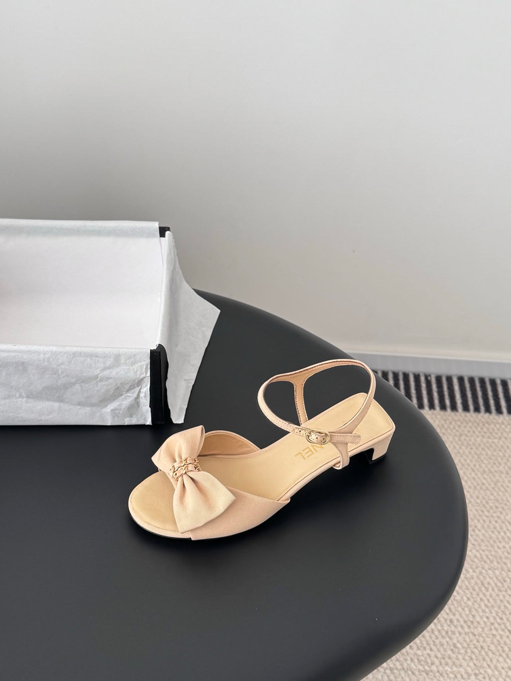 Beige heeled sandals with bow at toe and ankle strap