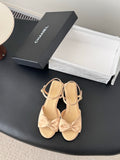 Beige slingback sandals with bow detail and low block heels