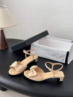 Beige slingback sandals with bow and ankle strap, low block heel