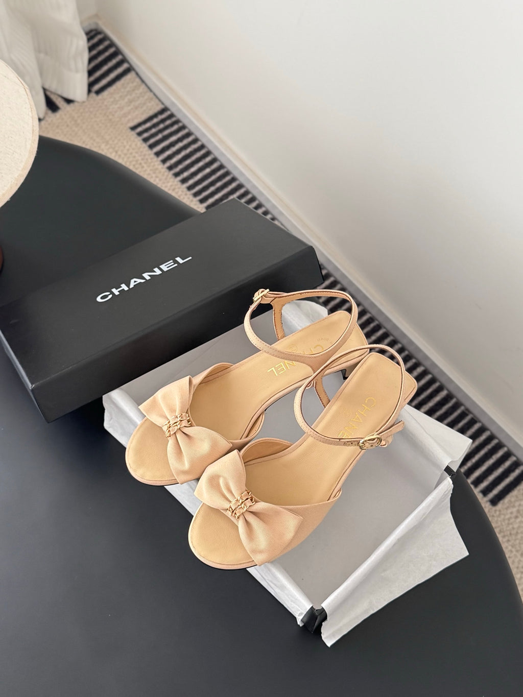 Beige slingback sandals with bow and ankle strap, gold-tone hardware