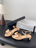 Beige slingback sandals with bow detail and square-toe block heel