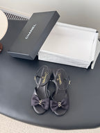 Chanel women's dark satin bow slingback sandals with gold-tone logo hardware