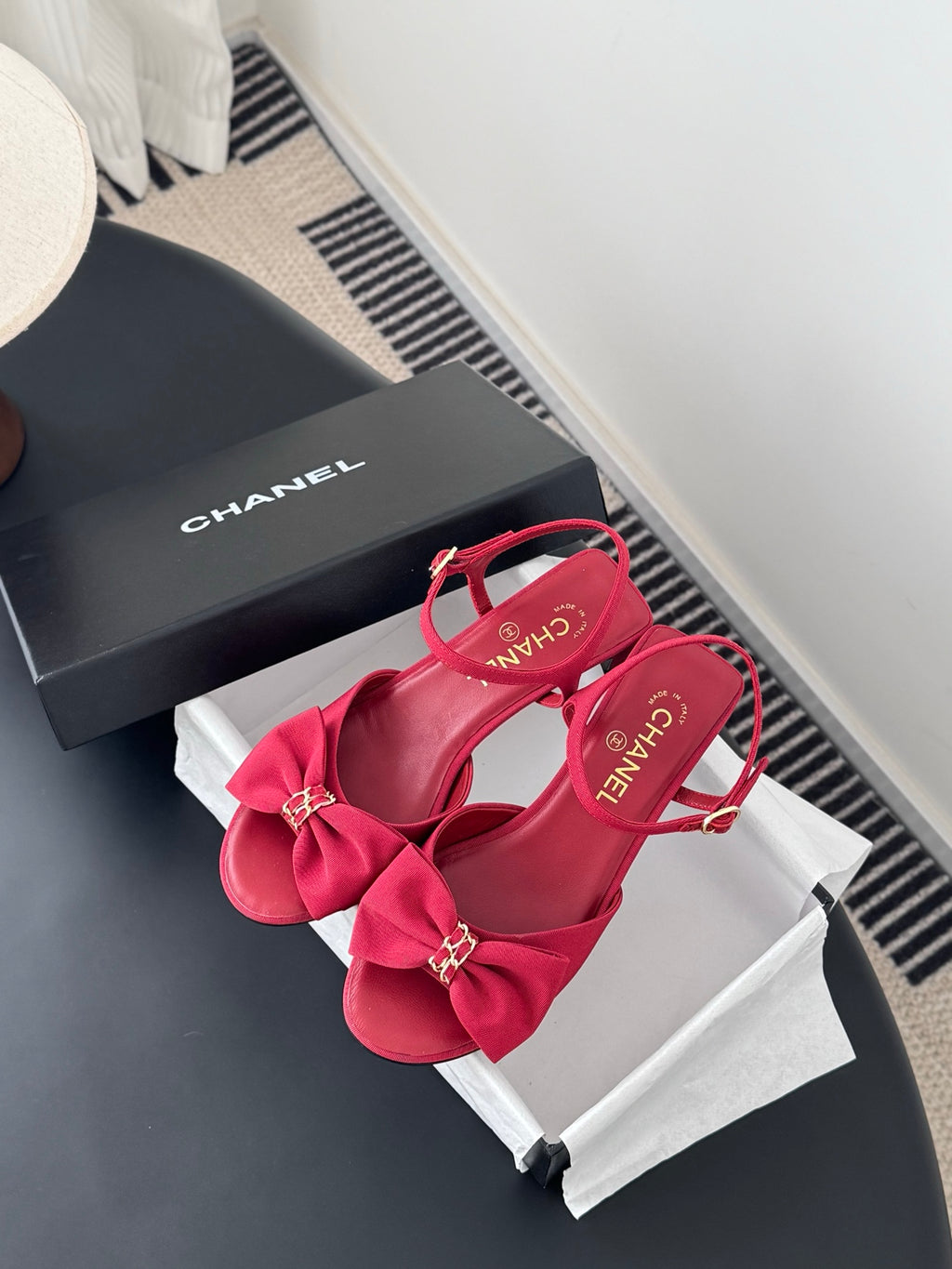 Pink Chanel sandals with bow accents, ankle strap, open toe and block heel
