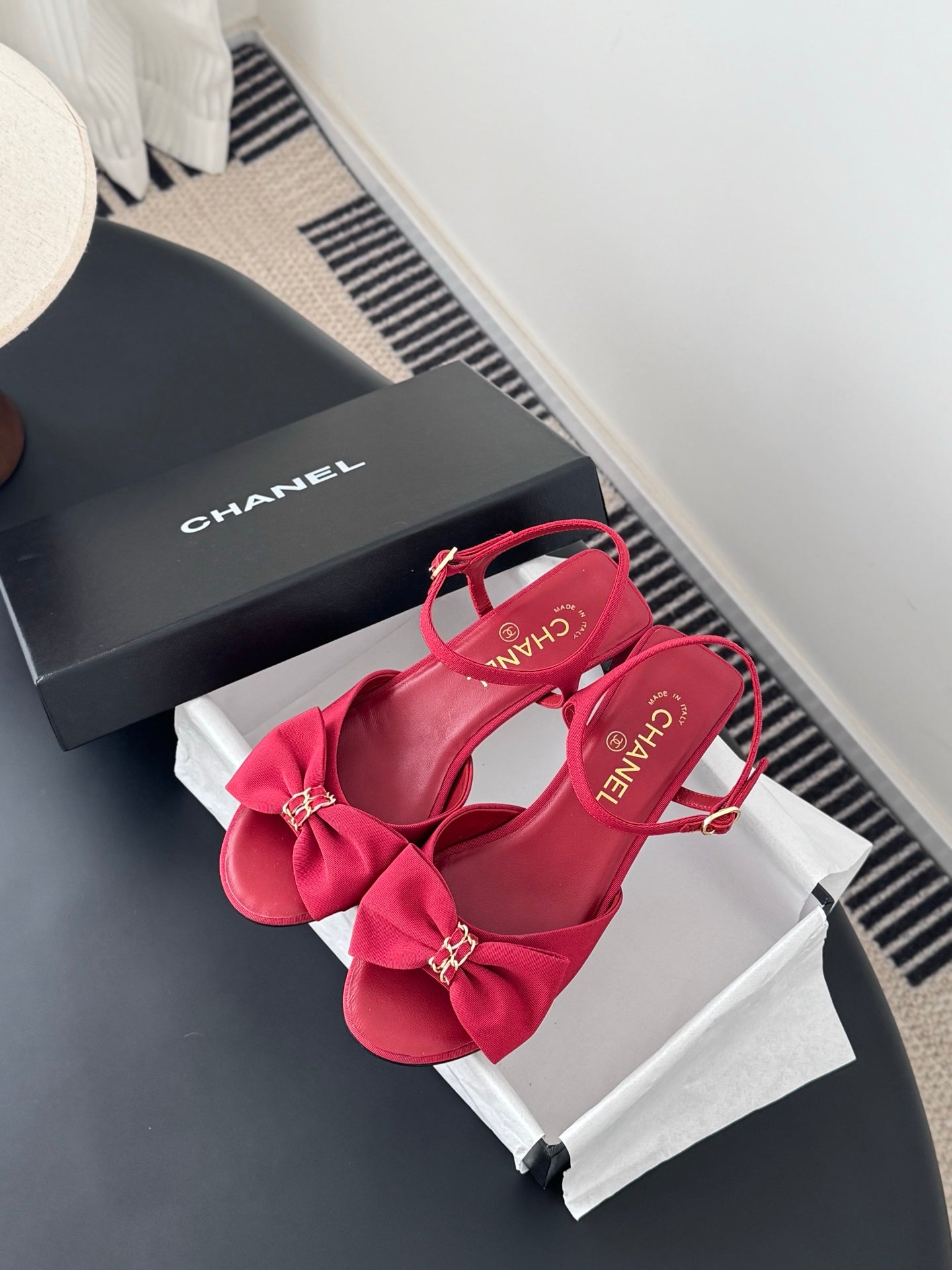 Pink Chanel sandals with bow accents, ankle strap, open toe and block heel