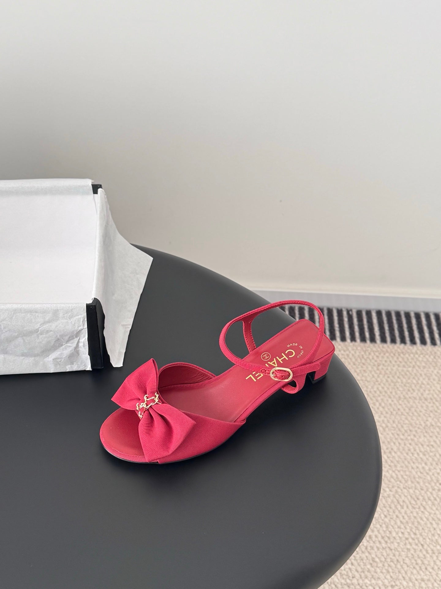 Pink bow slingback sandals with ankle strap and open toe, curved block heel