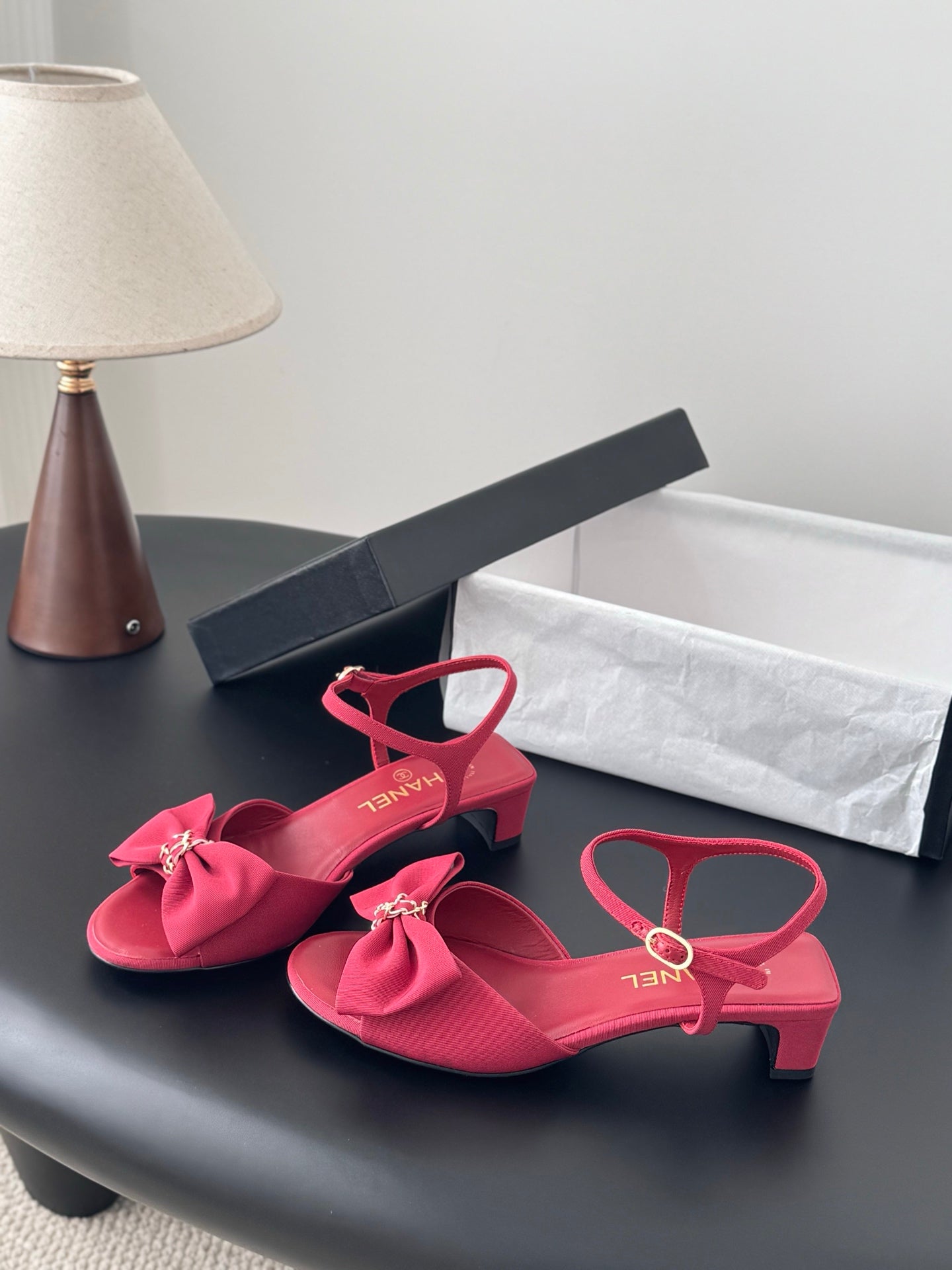 Pink open-toe slingback sandals with bow detail and ankle strap, block heel