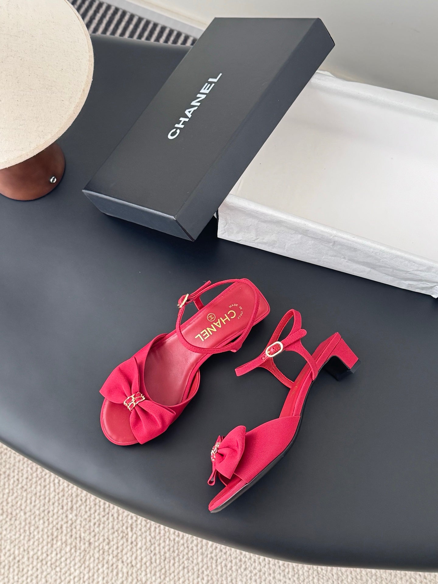 Pink strappy sandals with bow detail, ankle strap, and mid-height block heel