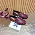 Burgundy leather loafers with gold crest and plaid lining, pair side view