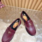 Burgundy leather loafers with gold crest and plaid lining, tilted front pair view
