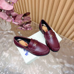 Burgundy leather loafers with gold crest hardware and plaid interior, pair view