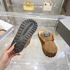 Balenciaga suede slip-on shoes with visible outsole tread and black logo patch