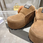 Balenciaga brown suede slip-on shoe on light sole, with black logo label on top