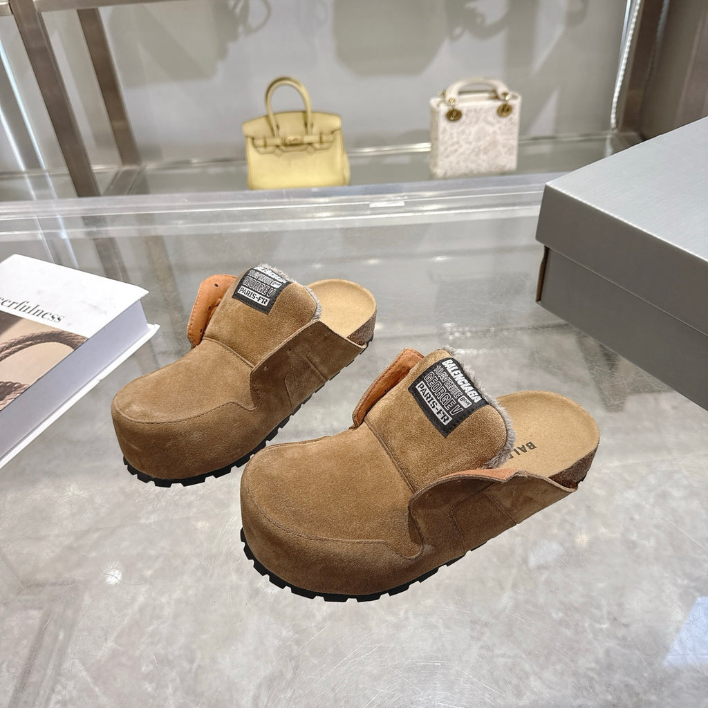 Balenciaga brown suede mules with fur trim, black logo label, and rugged outsole