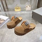 Balenciaga brown suede mules with fur trim, black logo label, and rugged outsole