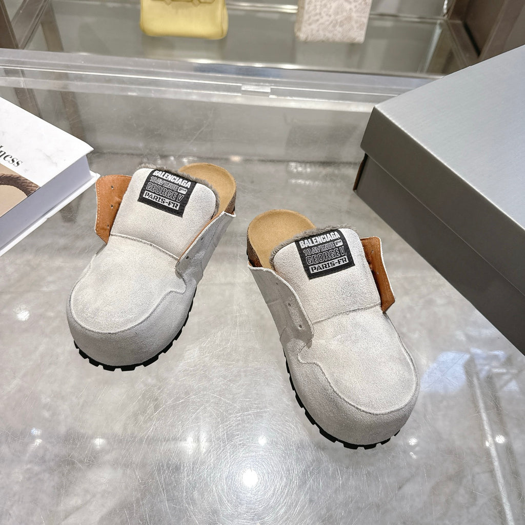 Balenciaga slip-on shoes in light gray suede, side view with shearling collar and tread sole