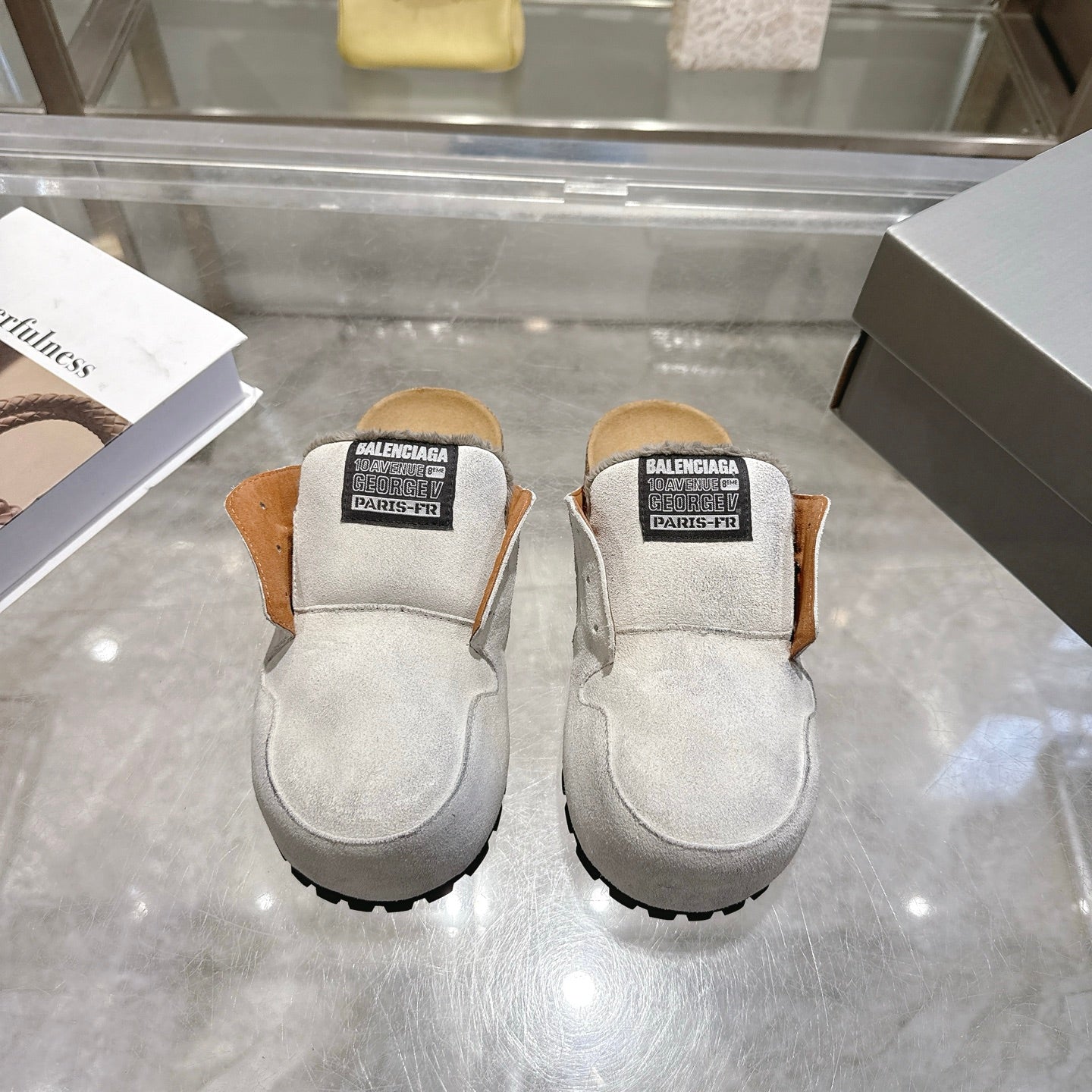 Balenciaga slip-on shoes in light gray suede, with shearling-lined collar and rubber tread sole
