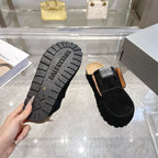 Outsole view and black slip-on mule with Balenciaga logo and chunky tread sole